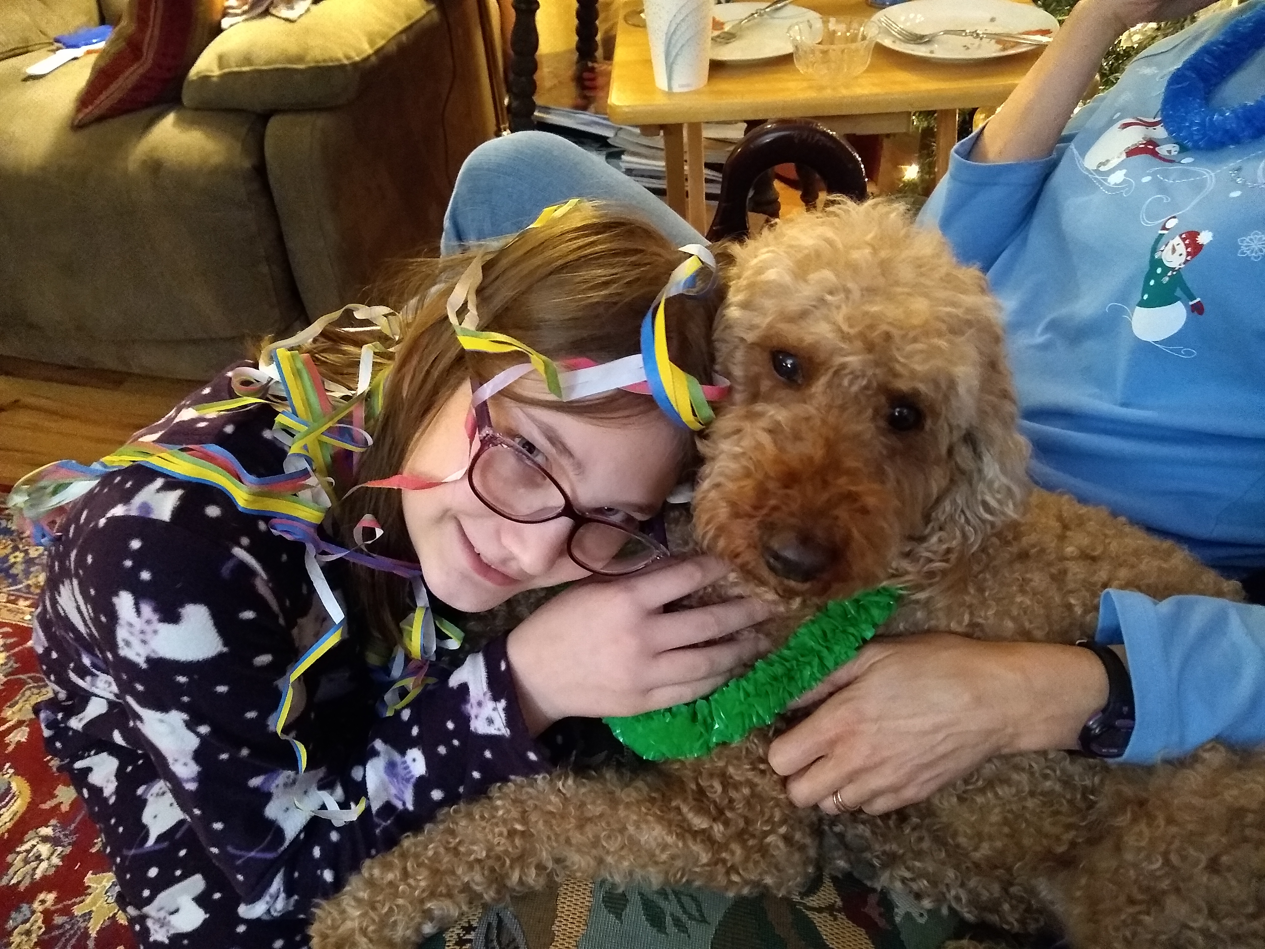 Dog celebrating New Year's Eve with child